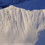 Aerial photo, steep snowy Chugach Mountain face, Alaska