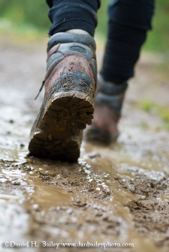 Hiking boots walking through the mud