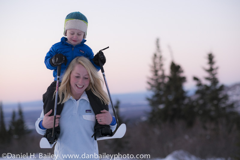 Megan Chelf carrying Brody on her shoulders at sunset, Anchorage foothills.