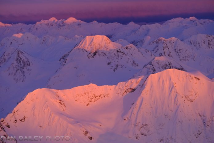 Aerial photo of the Chugach Mountains at sunset.